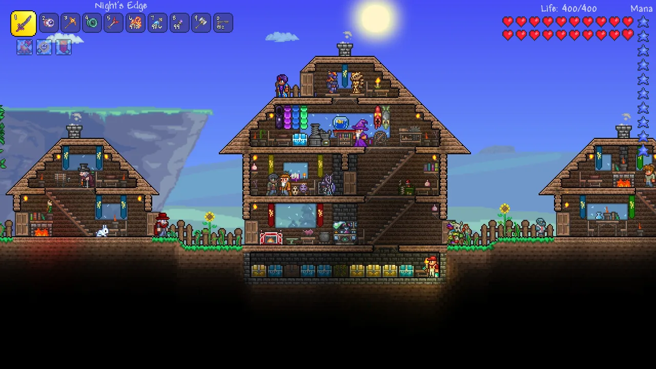 Terraria player-built base with multiple houses and NPCs
